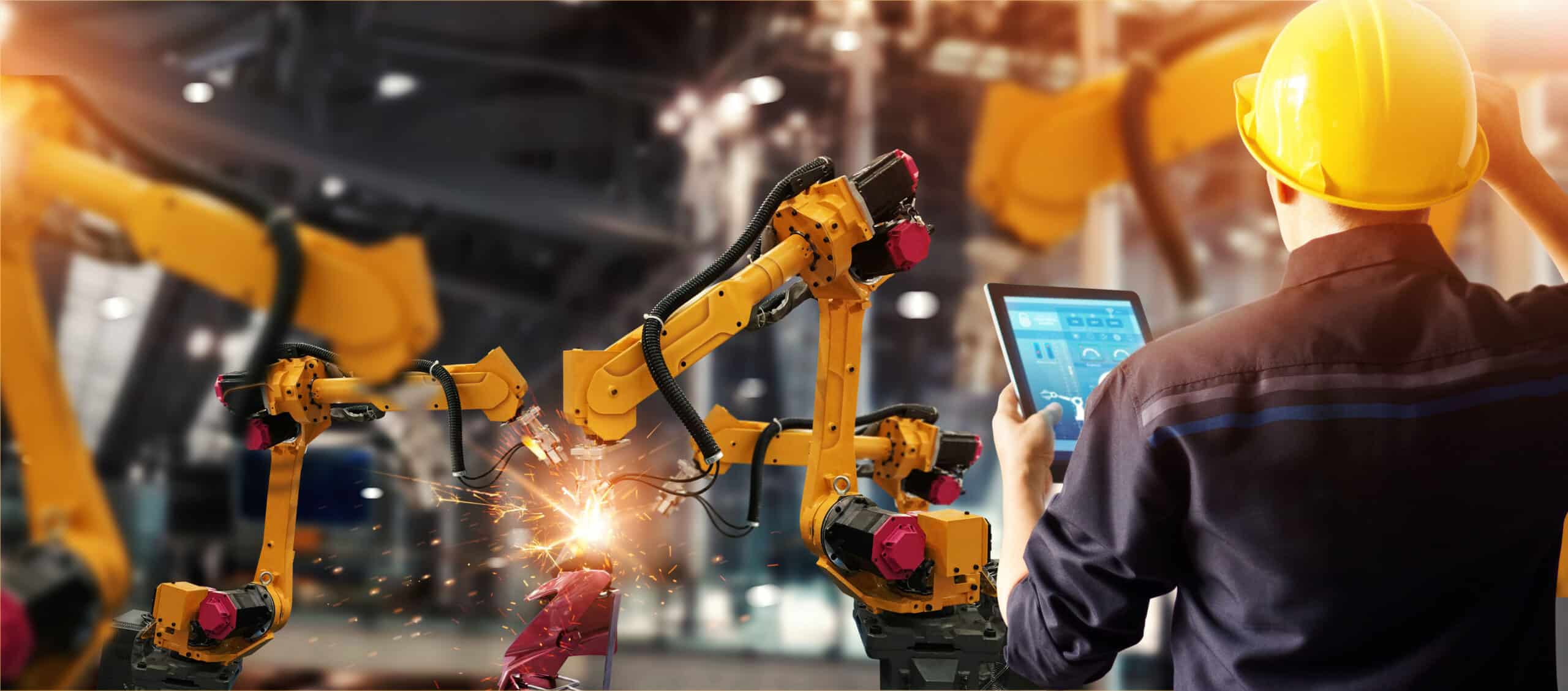 Manufacturing IT manager reviewing documentation to reduce operational risk